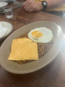 heesy Korean Jjajang Ramen (Jjagyechi) served in a black bowl at a modern pub in Seoul
