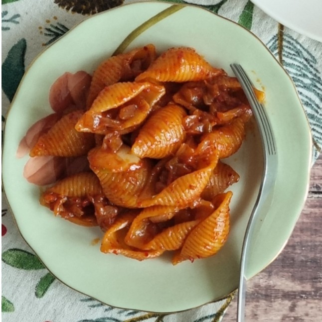 Gochujang Pasta with creamy sauce and garnished with green onions